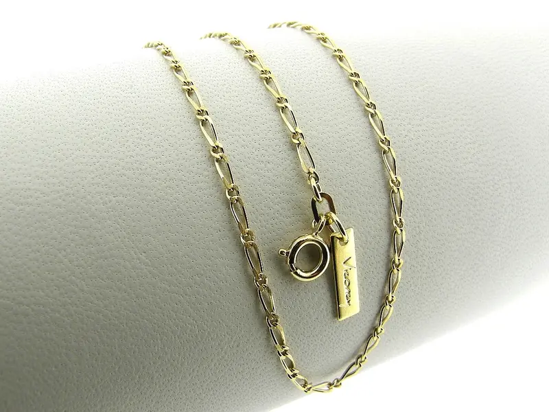 Gouden mini fantasie figaro collier met kleine schakeltjes