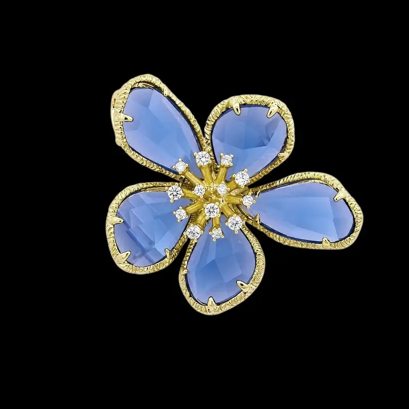 Goudkleurige Fiore Mio Broche met Blauwe Zirkonia Stenen