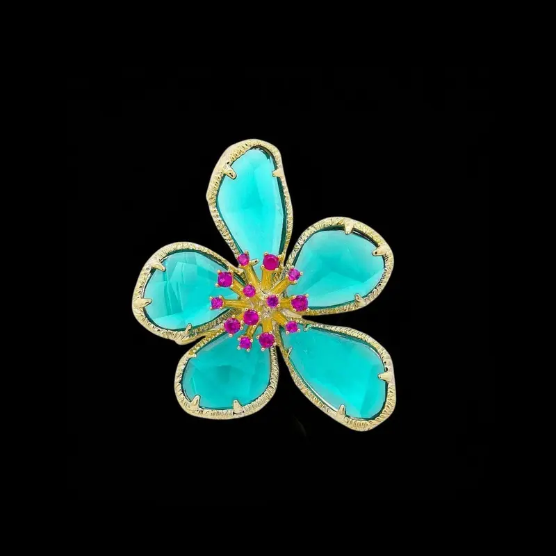 Goudkleurige Fiore Mio Broche met Turquoisekleurige Zirkonia Stenen