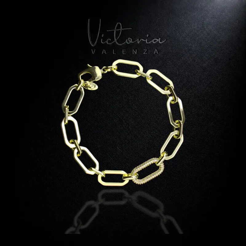 Goudkleurige Gina schakelarmband met zirkonia stenen