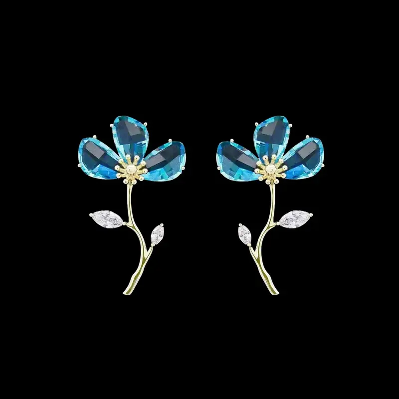 Goudkleurige vergeet-mij-nietjes oorbellen met blauwe zirkonia stenen