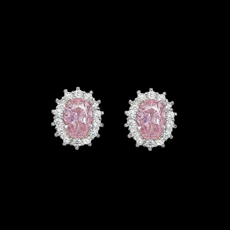 Zilverkleurige entourage oorknoppen met roze zirkonia's