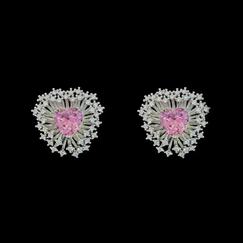 Zilverkleurige fantasie oorbellen met roze hart zirkonia stenen