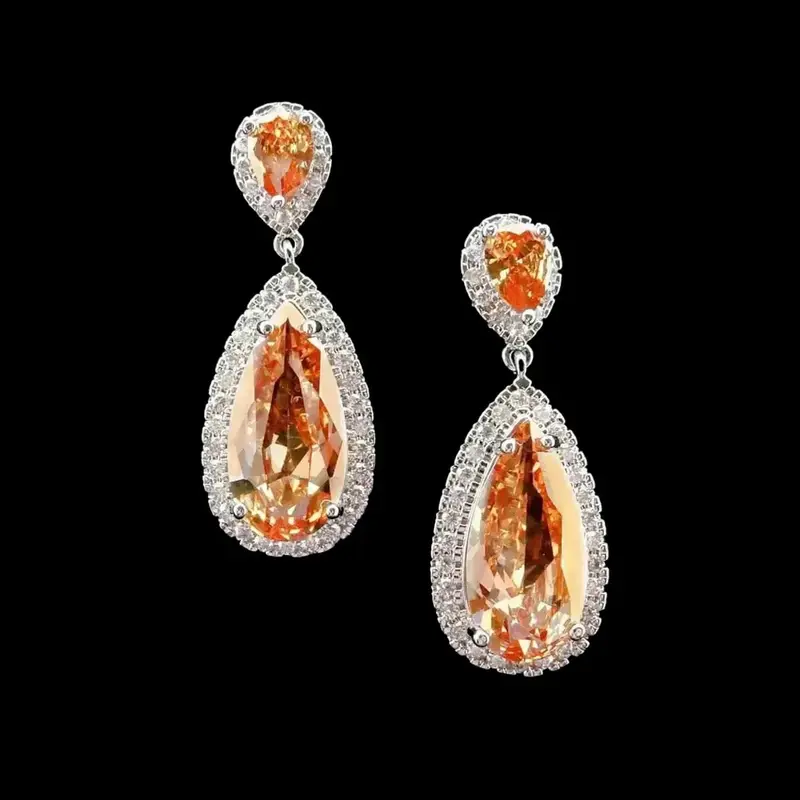 Zilverkleurige Oorbellen met Oranje Zirkonia Stenen