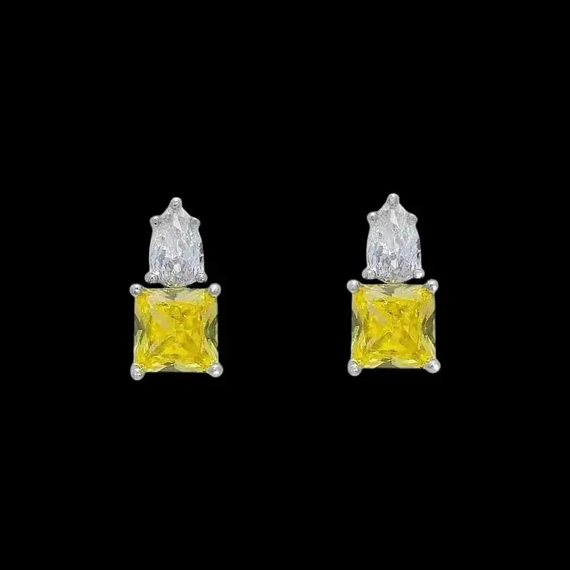 Zilverkleurige oorbellen met witte en gele zirkonia stenen