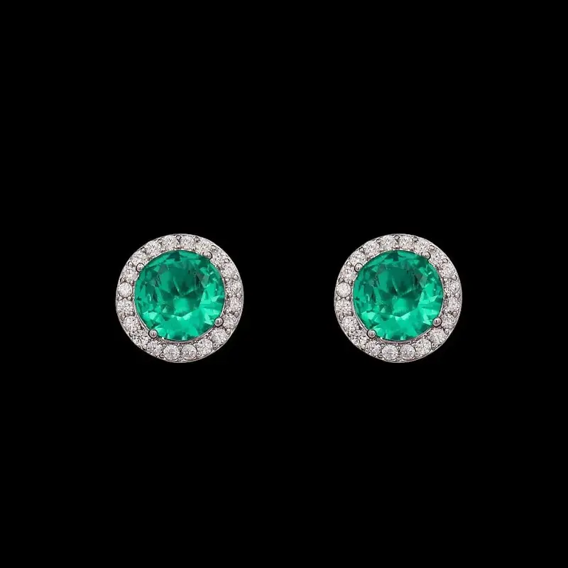 Zilverkleurige ronde turquoise entourage oorbellen met zirkonia stenen